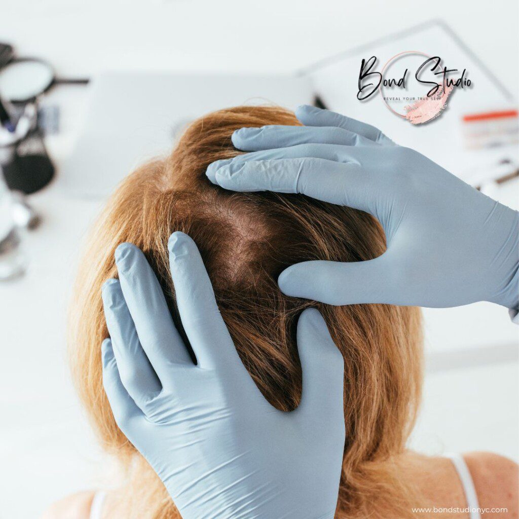 Woman having her hair and scalp examined